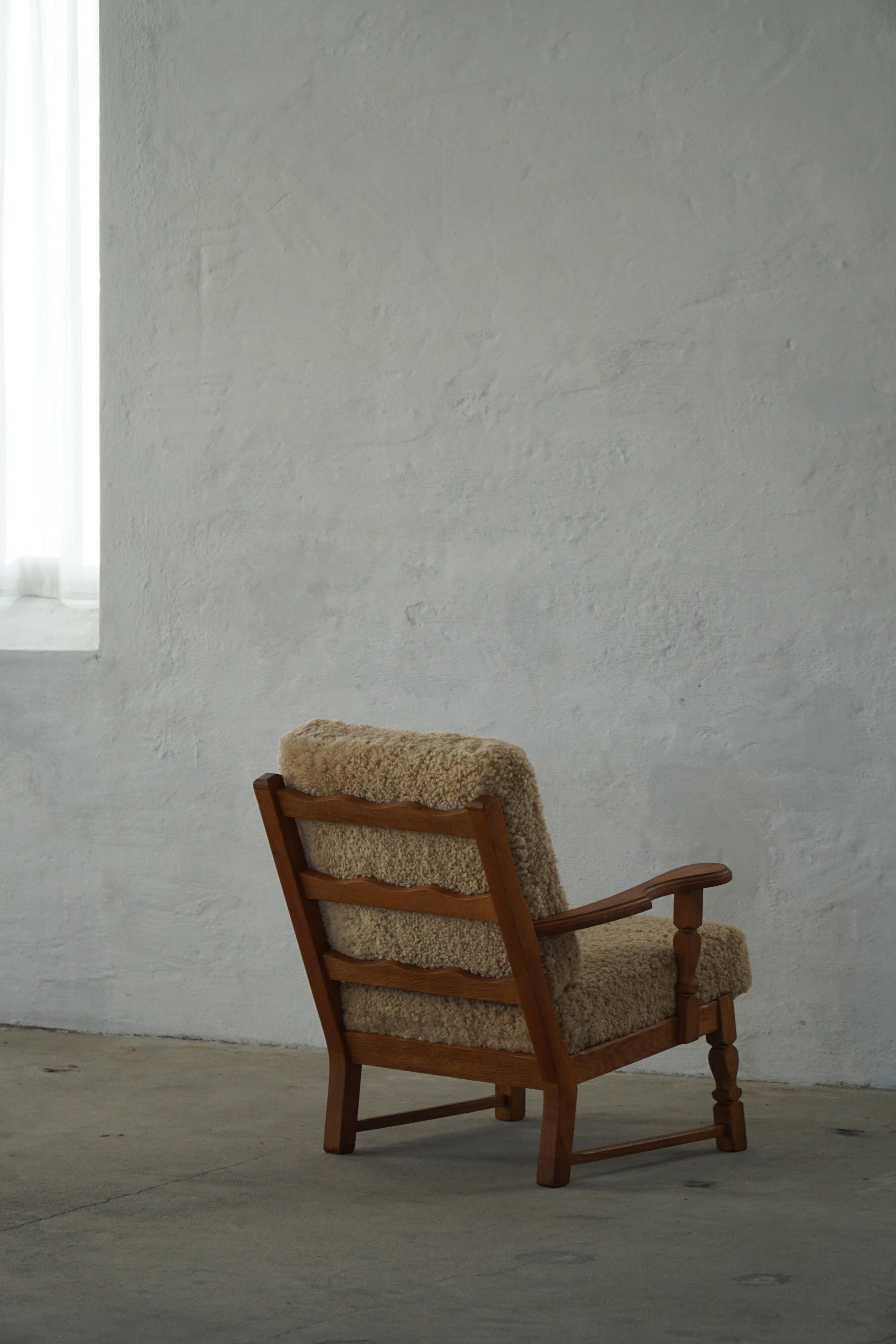 Danish modernist lounge chair in oak and lambswool, Henning Kjærnulf, 1960s