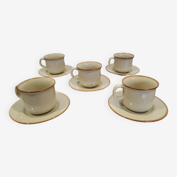 5 enameled stoneware cups and saucers