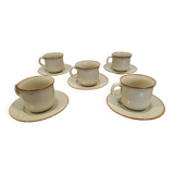 5 enameled stoneware cups and saucers