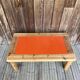 Modernist pine and orange lacquered coffee table, 1970s