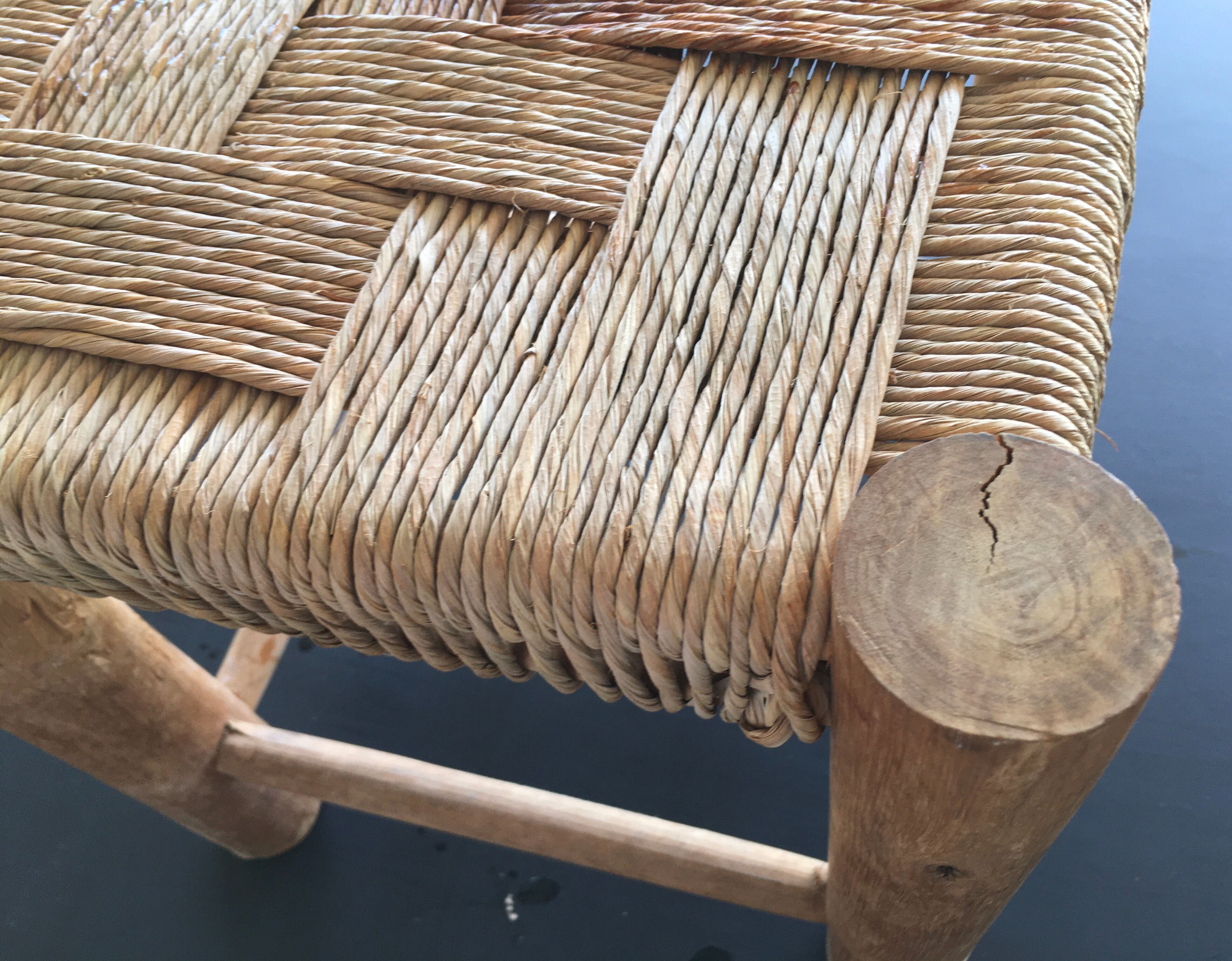 Wooden stool seated in braided rope