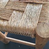 Wooden stool seated in braided rope