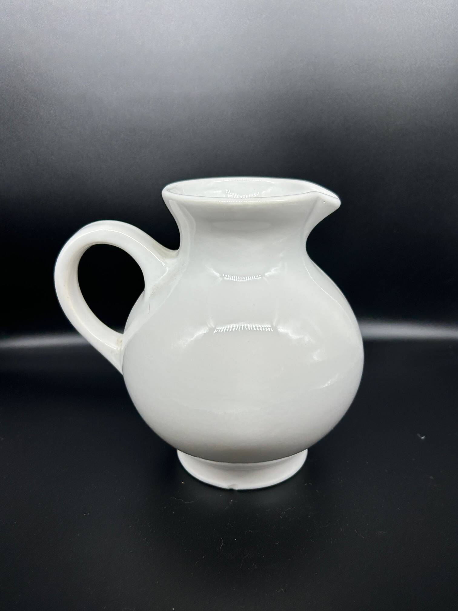 white ceramic cherry jug