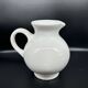 white ceramic cherry jug