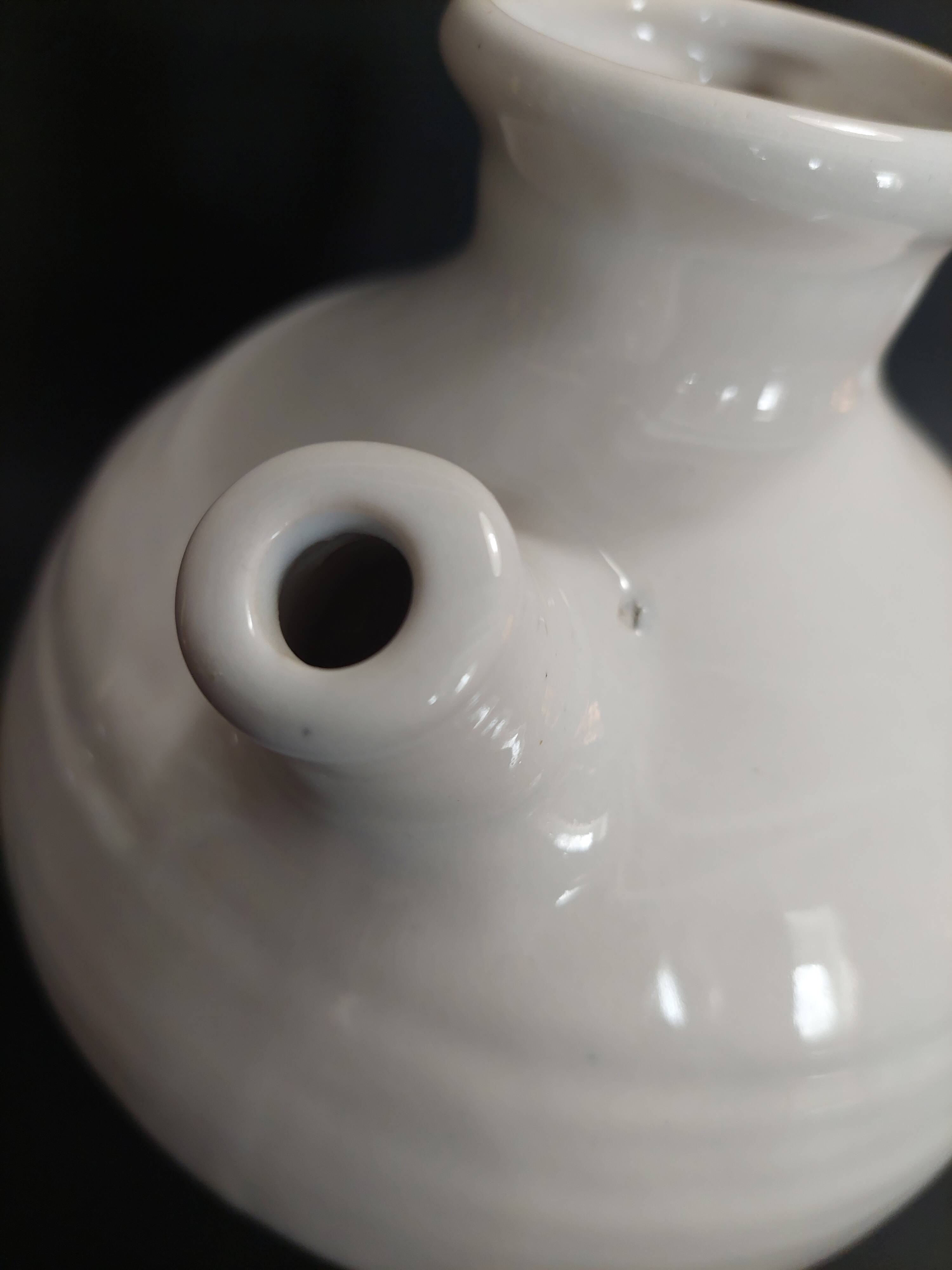 White ceramic goat-shaped creamer, first half of the 20th century.