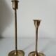 Set of two straight brass candlesticks.