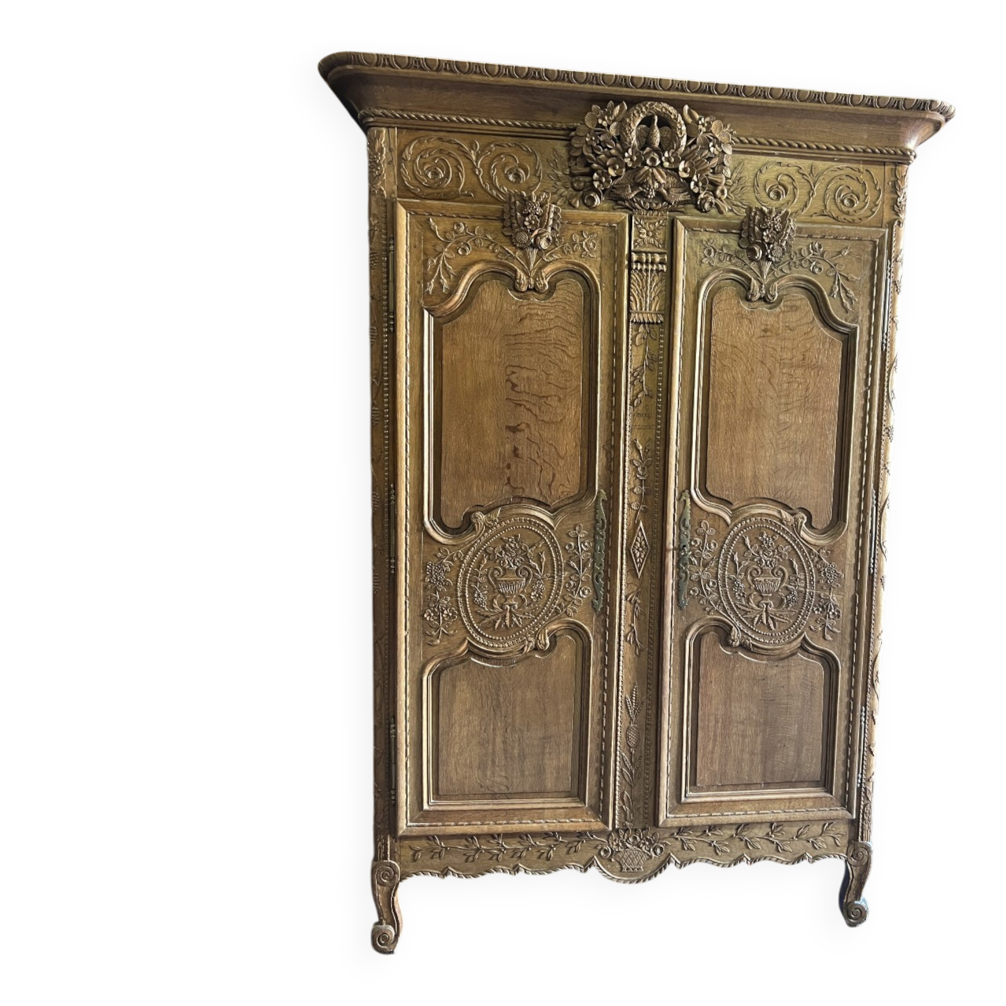 19th-century Norman wedding armoire, with bouquets of flowers and doves.
