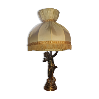 Brass cherub-laying lamp