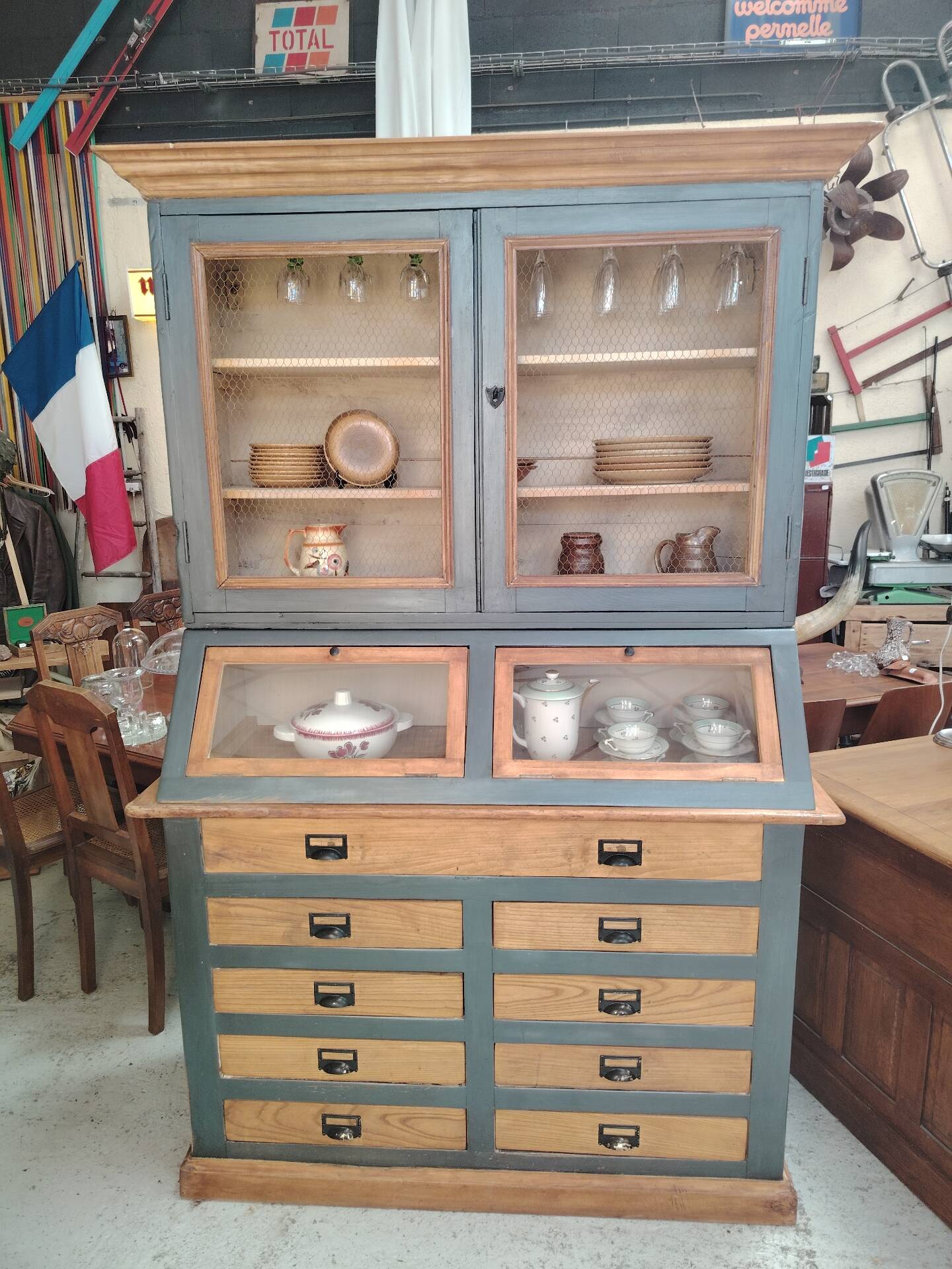 Large two-body grain merchant cabinet made of solid wood.