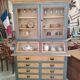 Large two-body grain merchant cabinet made of solid wood.
