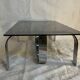 Vintage coffee table from the 70s in chrome and smoked glass, Space Age and Mid-Century style.