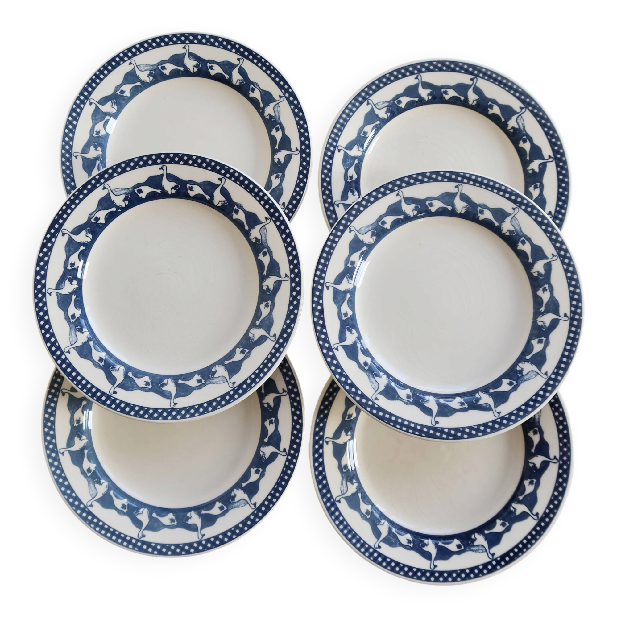 6 vintage flat plates with a blue and white goose pattern.
