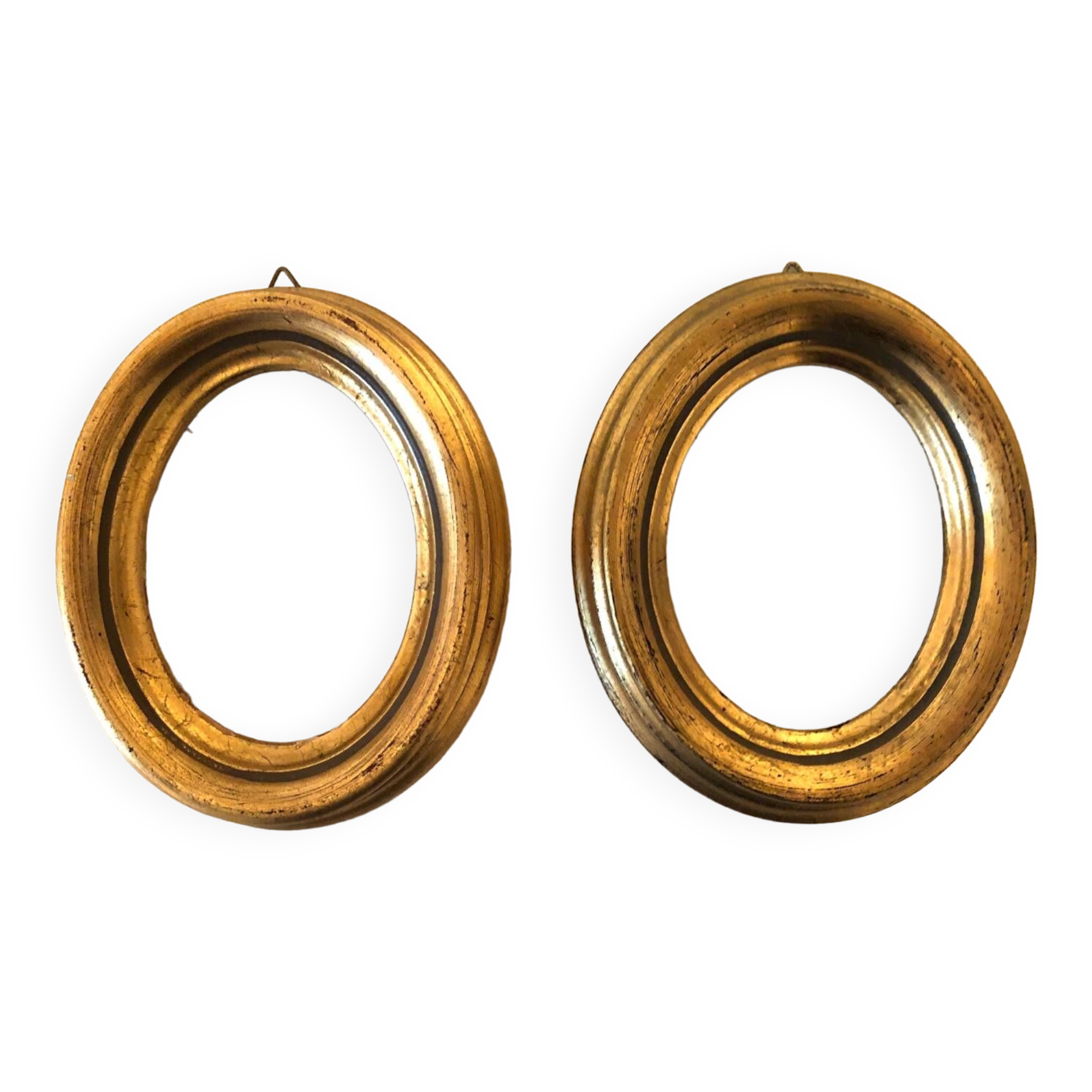 Pair of old oval golden wood frames