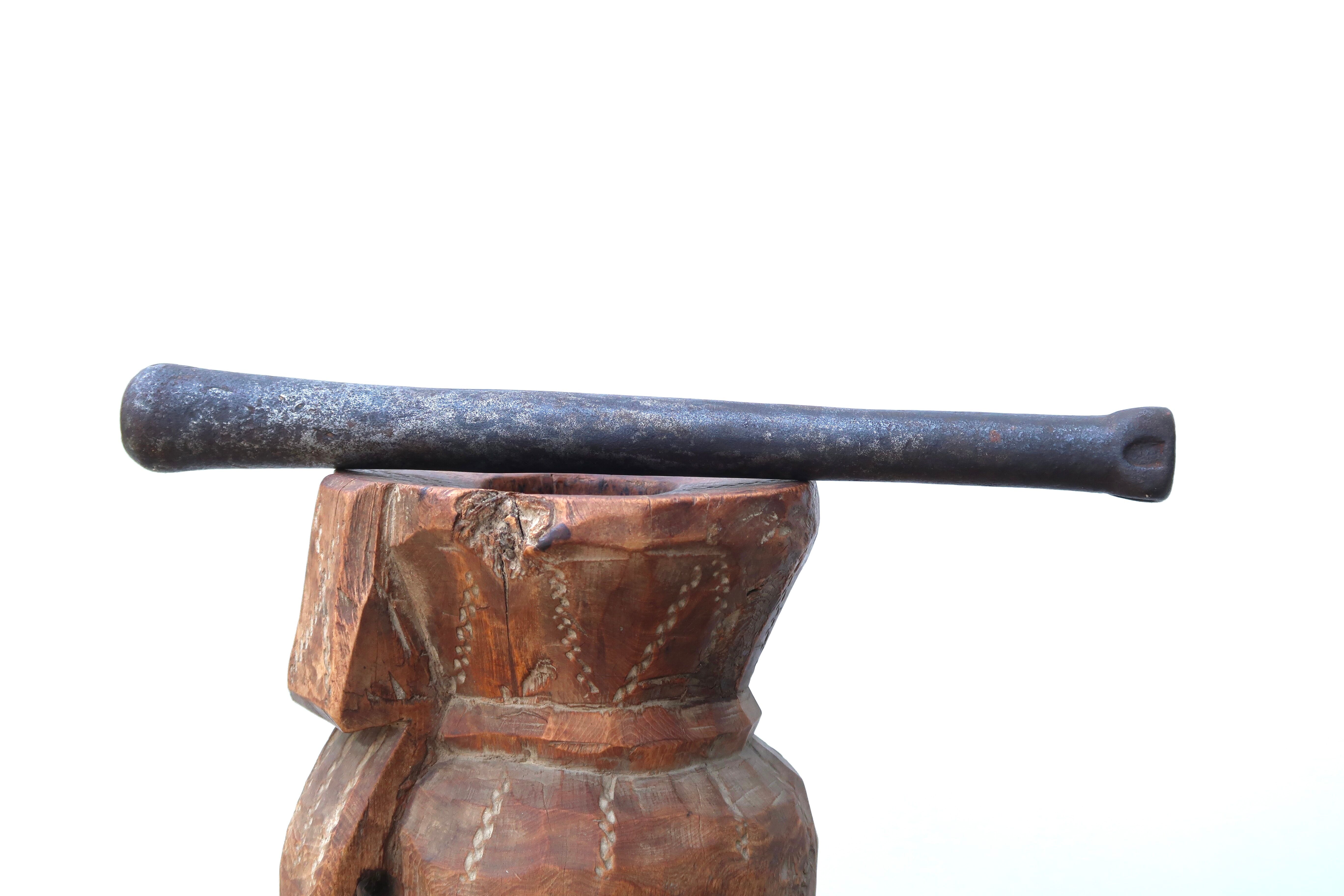 African mortar in carved wood, cast iron pestle, 70s