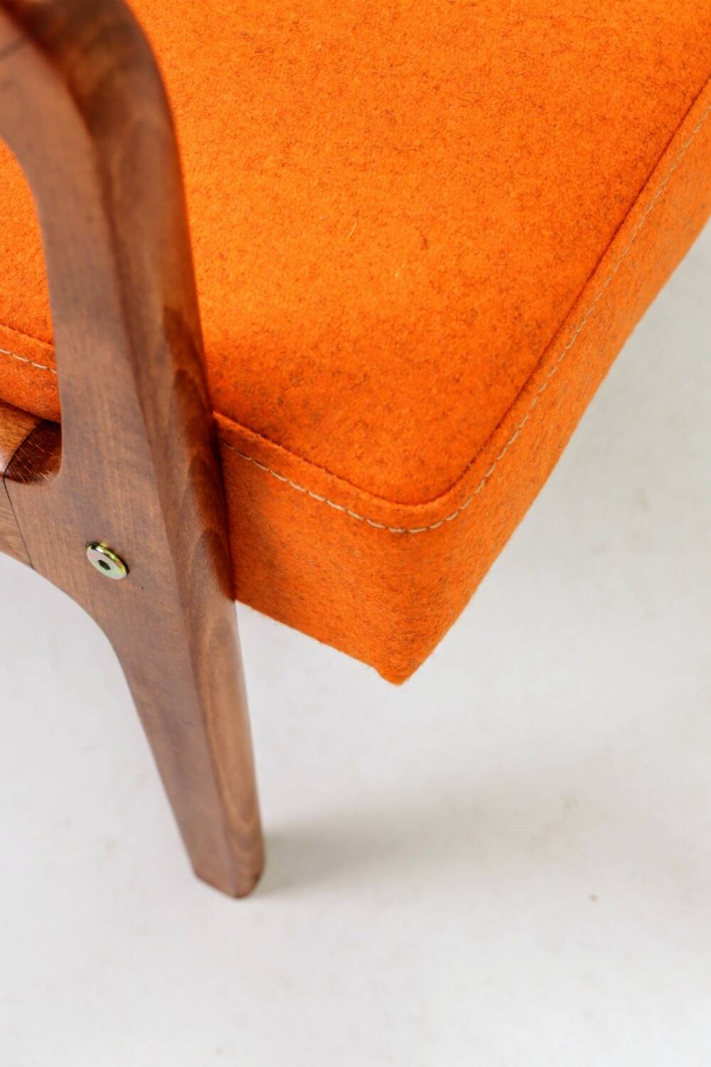 Vintage armchair in papaya orange wool from the 1960s.