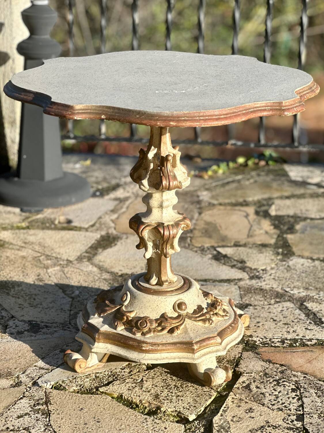 Carved and lacquered wooden side table.