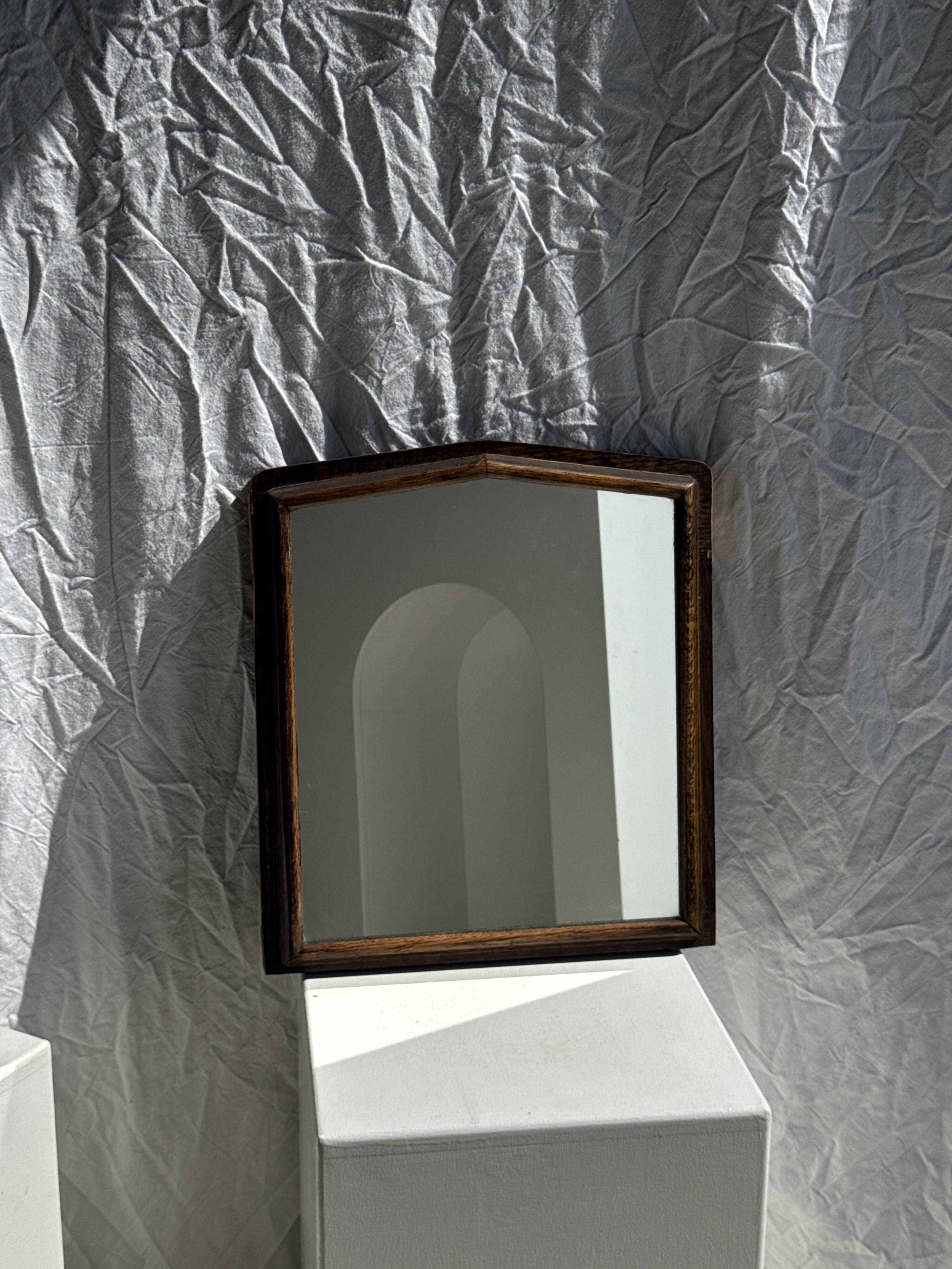 Small antique English rectangular mirror with pediment and oak frame