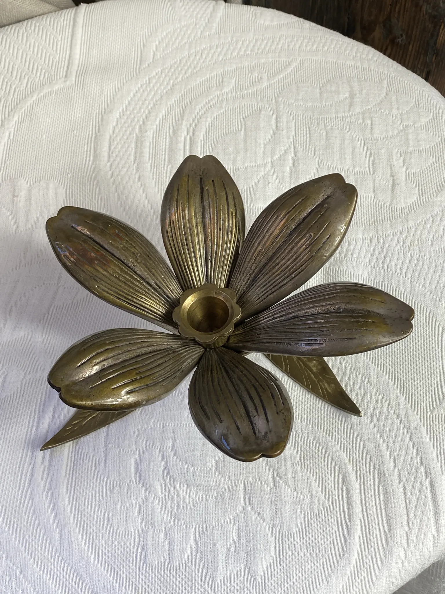 Flower candlestick and removable ashtrays in solid brass.