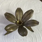 Flower candlestick and removable ashtrays in solid brass.