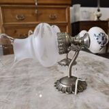 Pair of vintage wall sconces in brass, porcelain, and frosted glass.