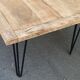 Wooden coffee table with pin legs