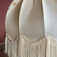 Fringed white bedside lamp