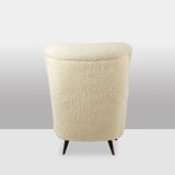 Armchair, or bergère, with its boucle fabric. 1950s