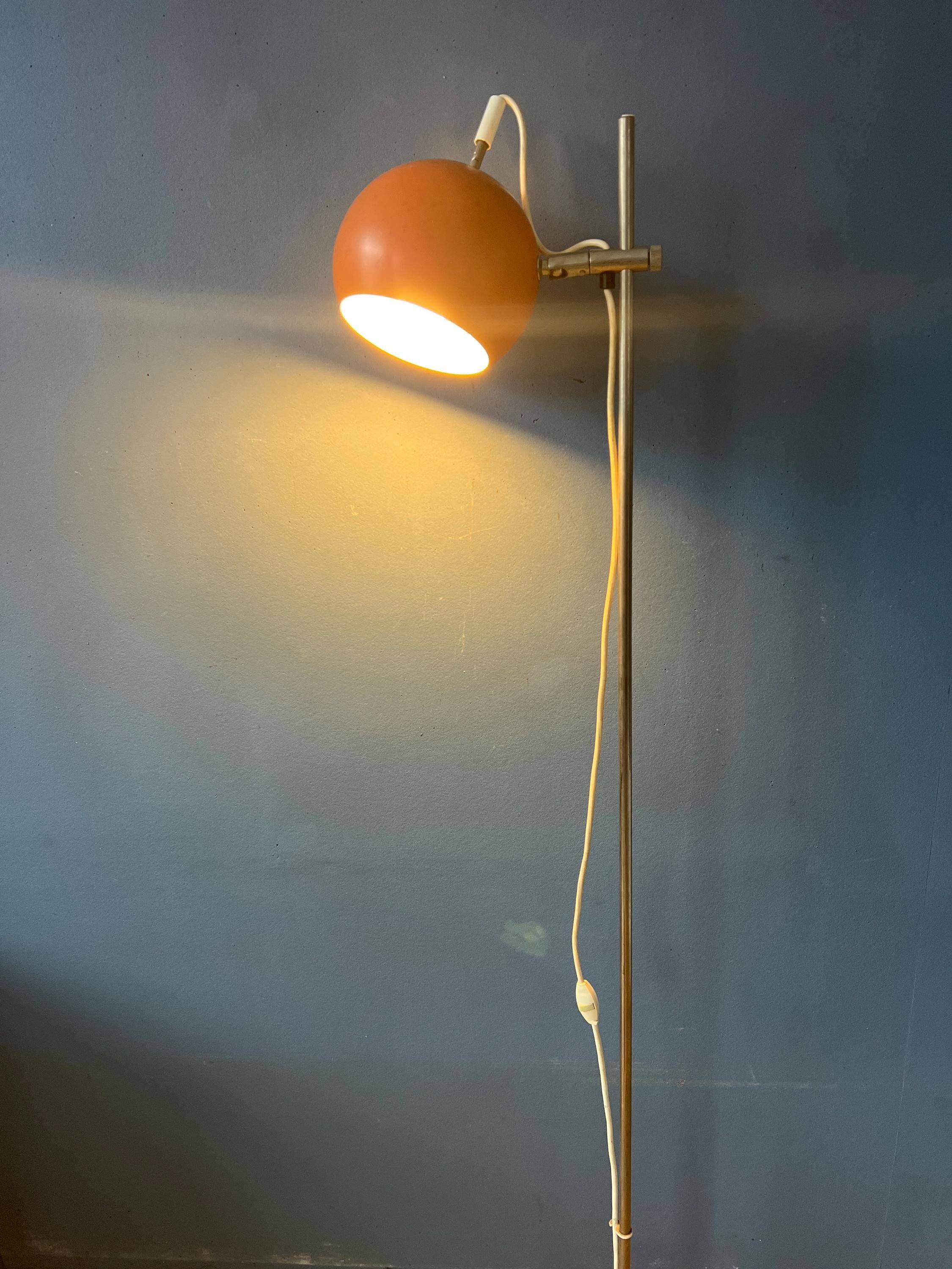 Mid-Century orange floor lamp with "eyeball" shade