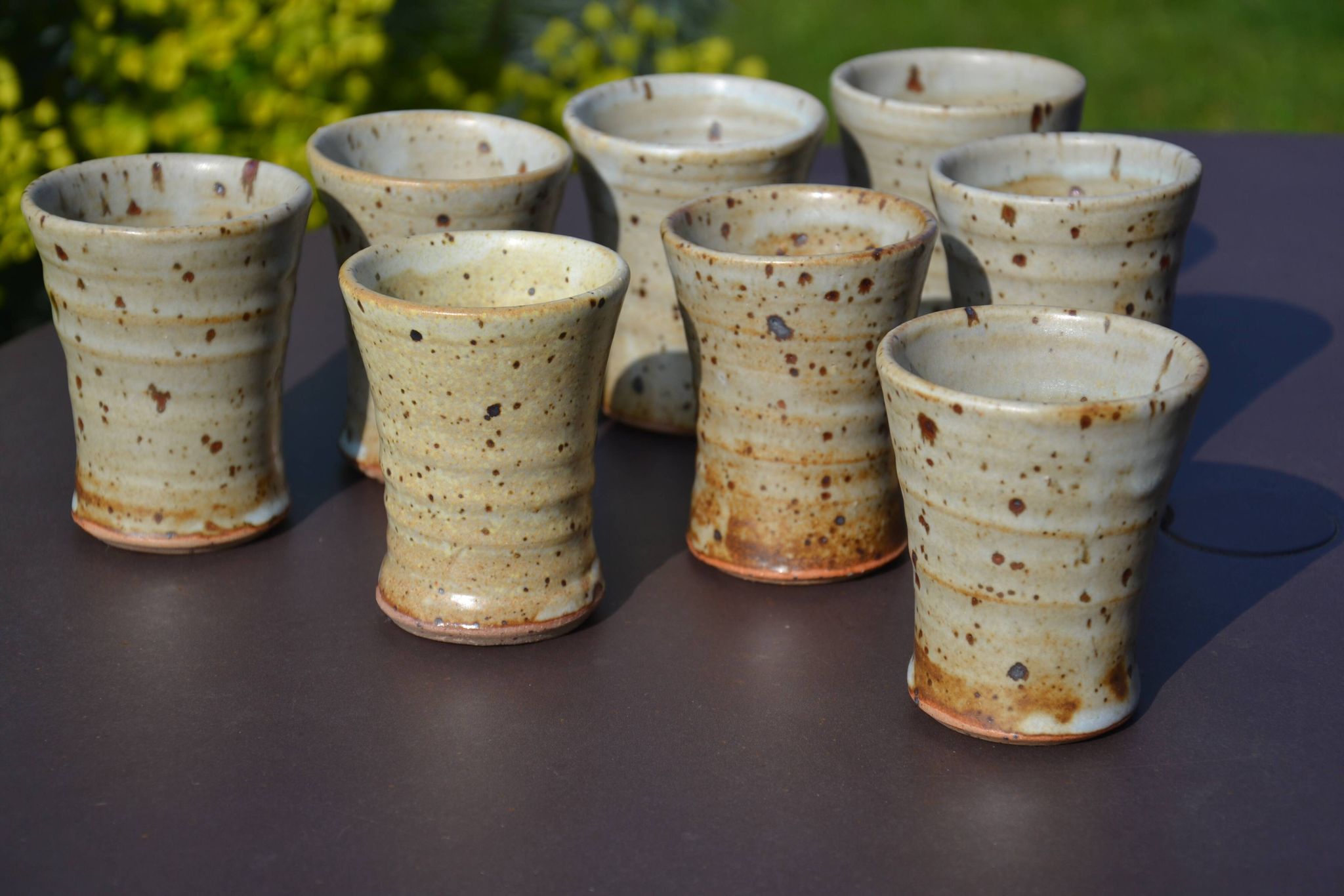 8 stoneware cups/mugs by Gustave Tiffoche