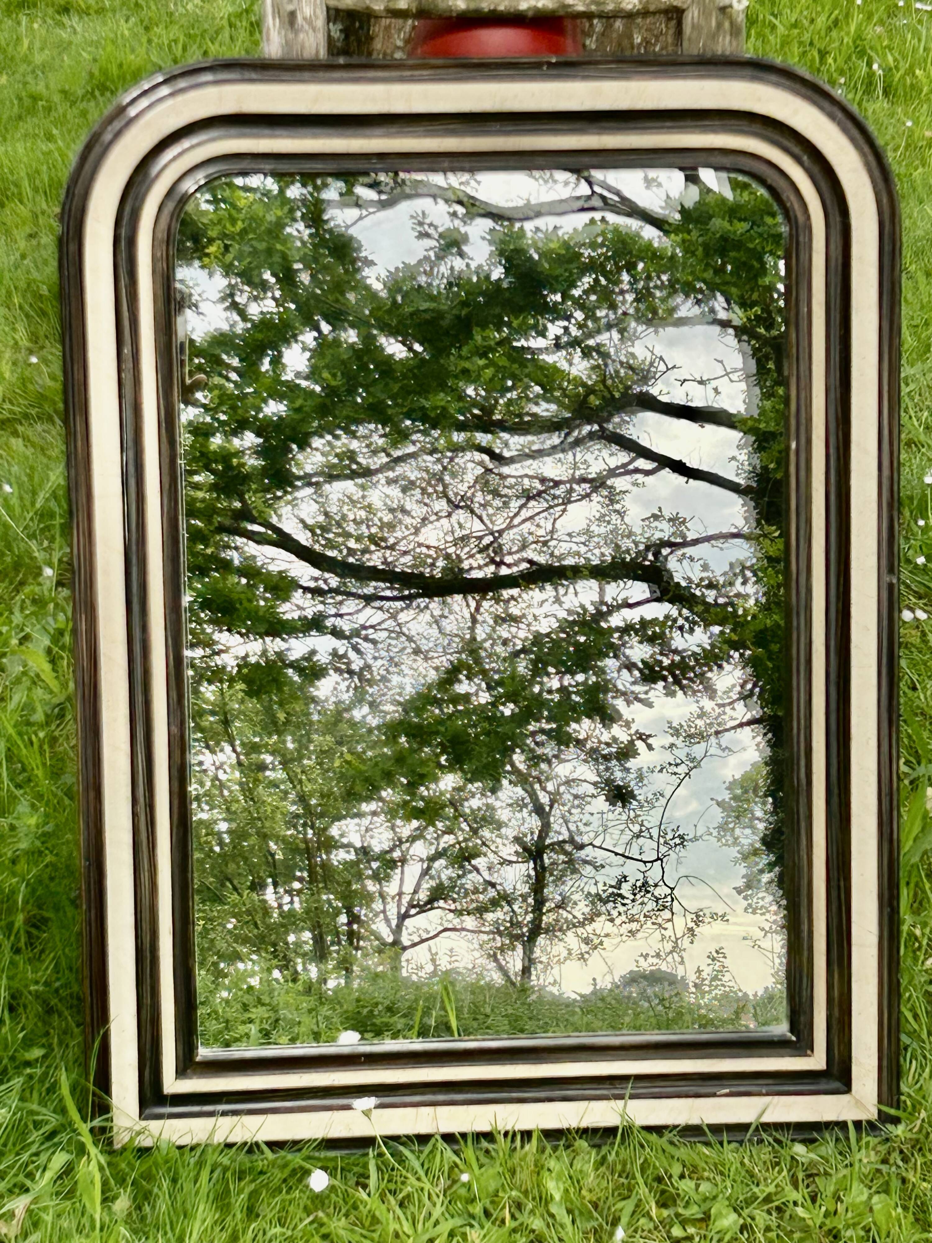 Louis Philippe mirror, wood and stucco with faux wood decoration. 19th century. 56 x 74.