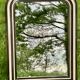 Louis Philippe mirror, wood and stucco with faux wood decoration. 19th century. 56 x 74.