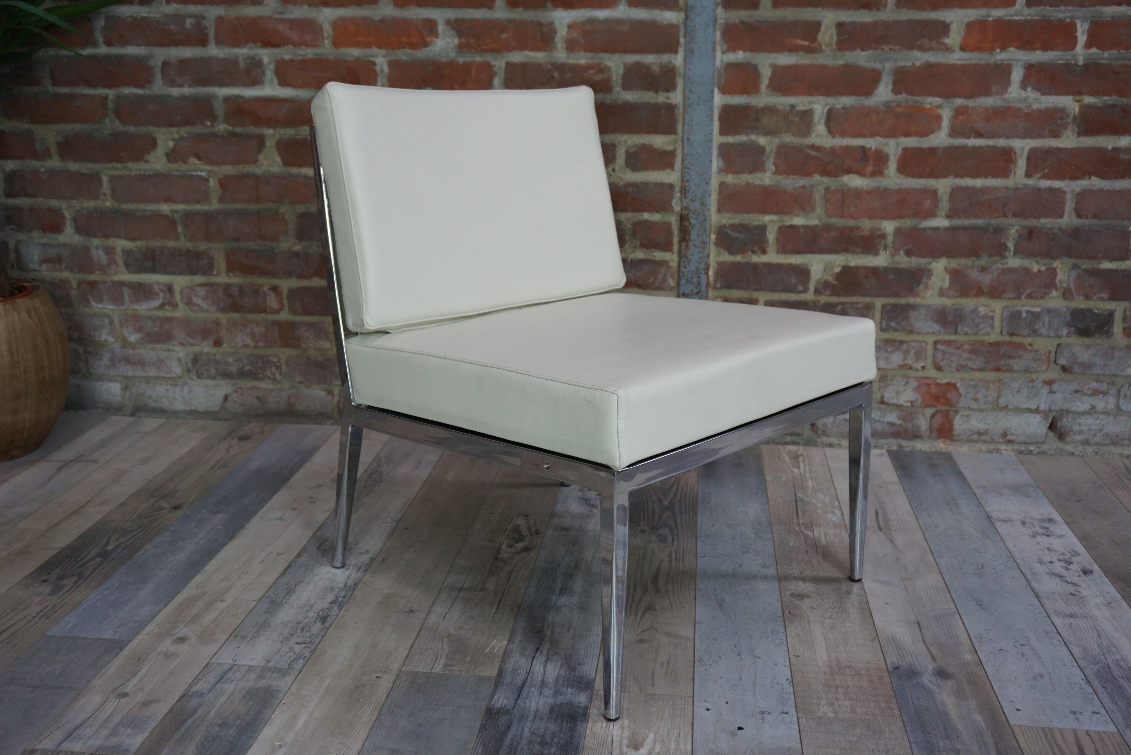 Pair of chrome and leather armchairs