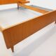 Double bed in vintage Scandinavian style from the 1960s with bedside tables.
