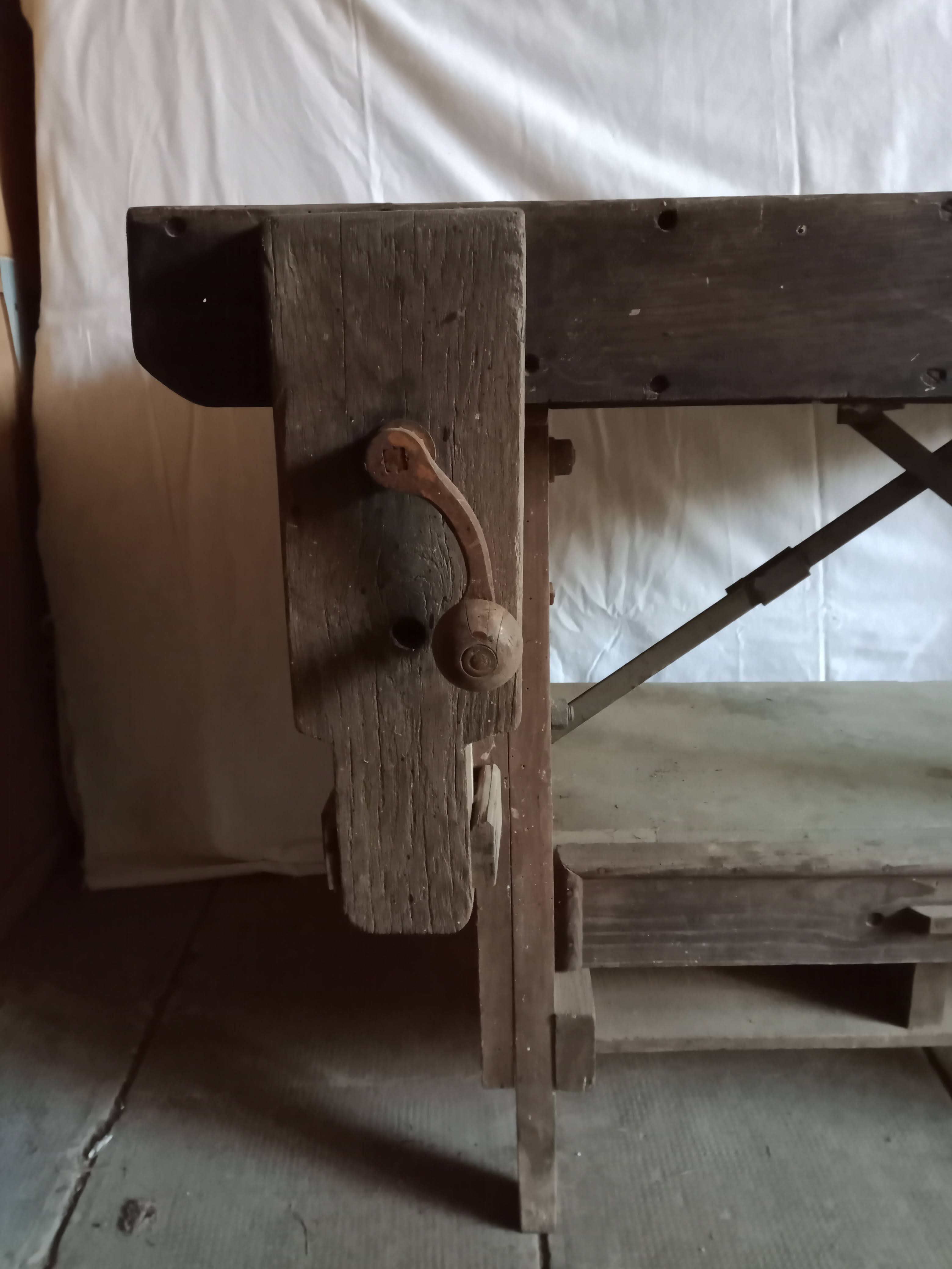 antique workbench with one drawer and two vices