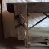 antique workbench with one drawer and two vices