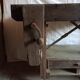 antique workbench with one drawer and two vices