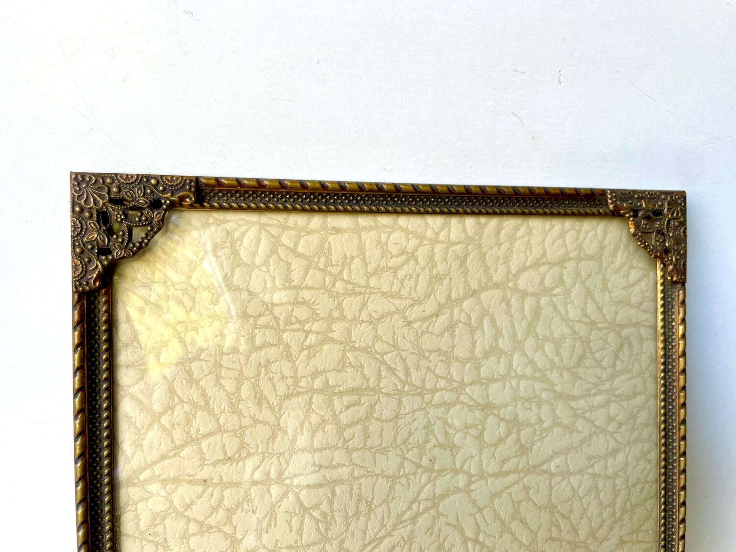 Metal frame in gold colored brass