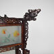 Asian wooden lantern carved with dragons and painted glass panels