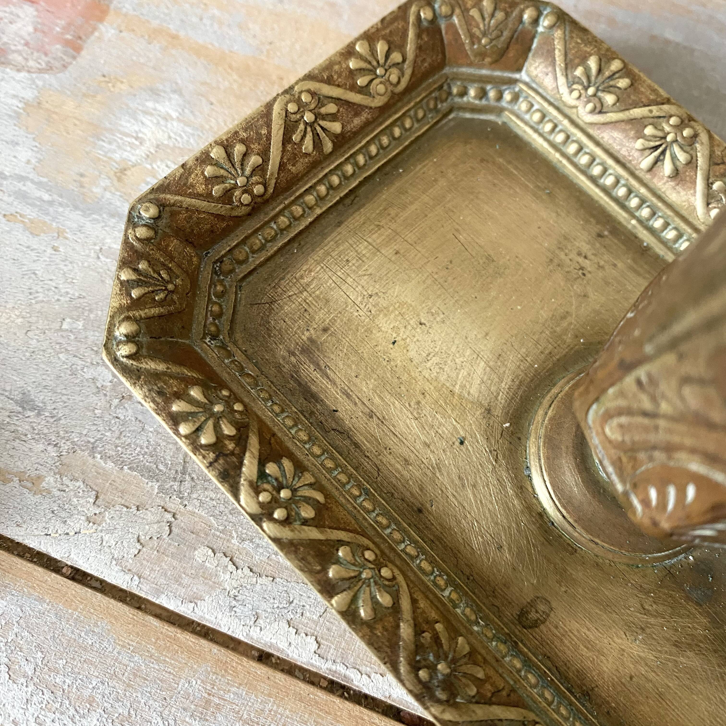 Antique brass thumb candle holder