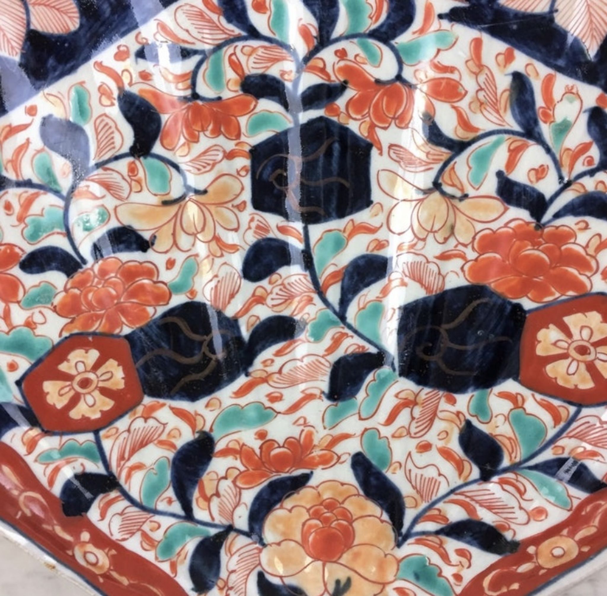 Imari porcelain dish from Japan in the shape of a scallop shell Blue, red and turquoise