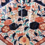 Imari porcelain dish from Japan in the shape of a scallop shell Blue, red and turquoise