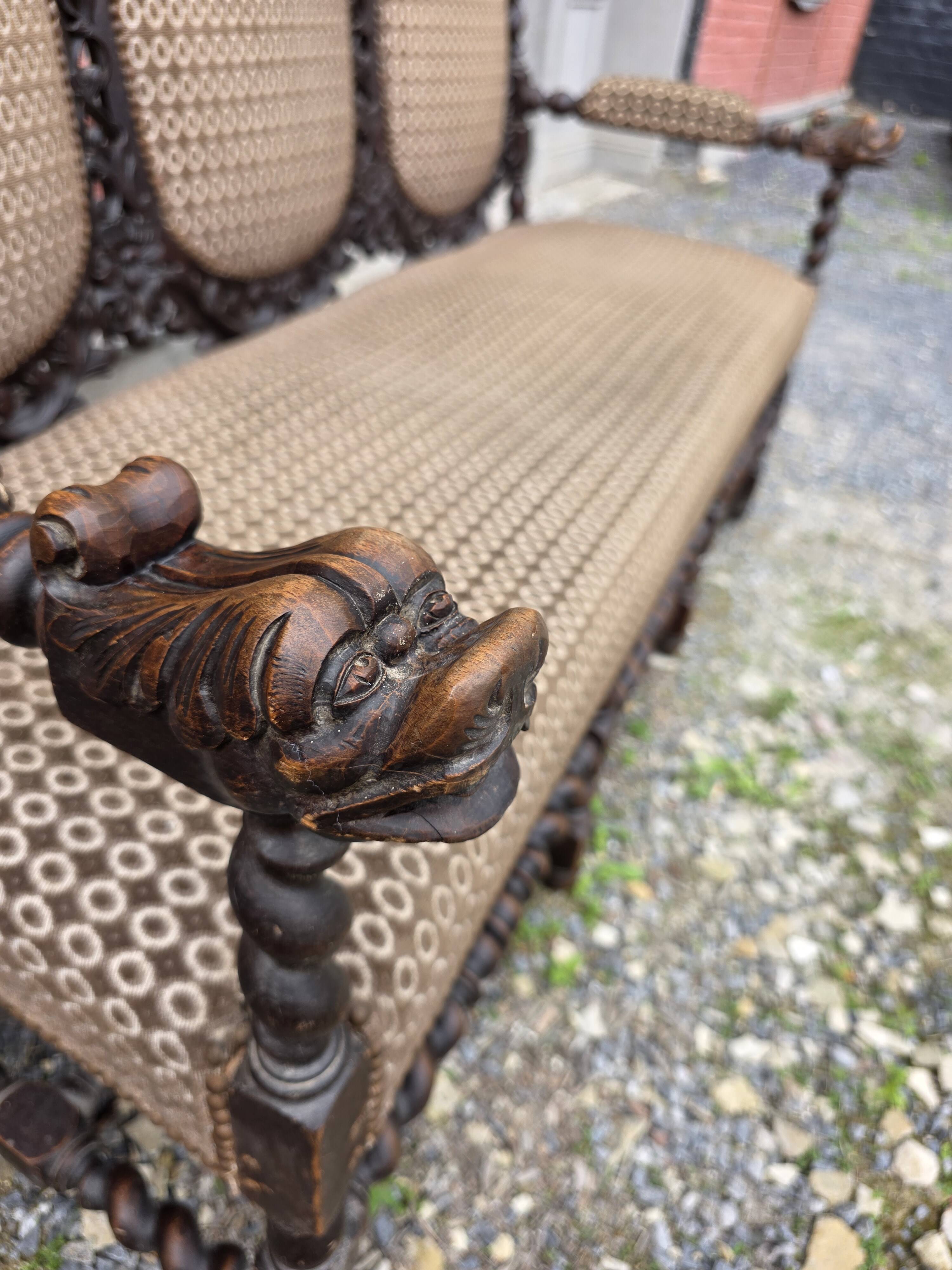 Three-seater armchair in Louis XIII style made of oak from the 19th century.