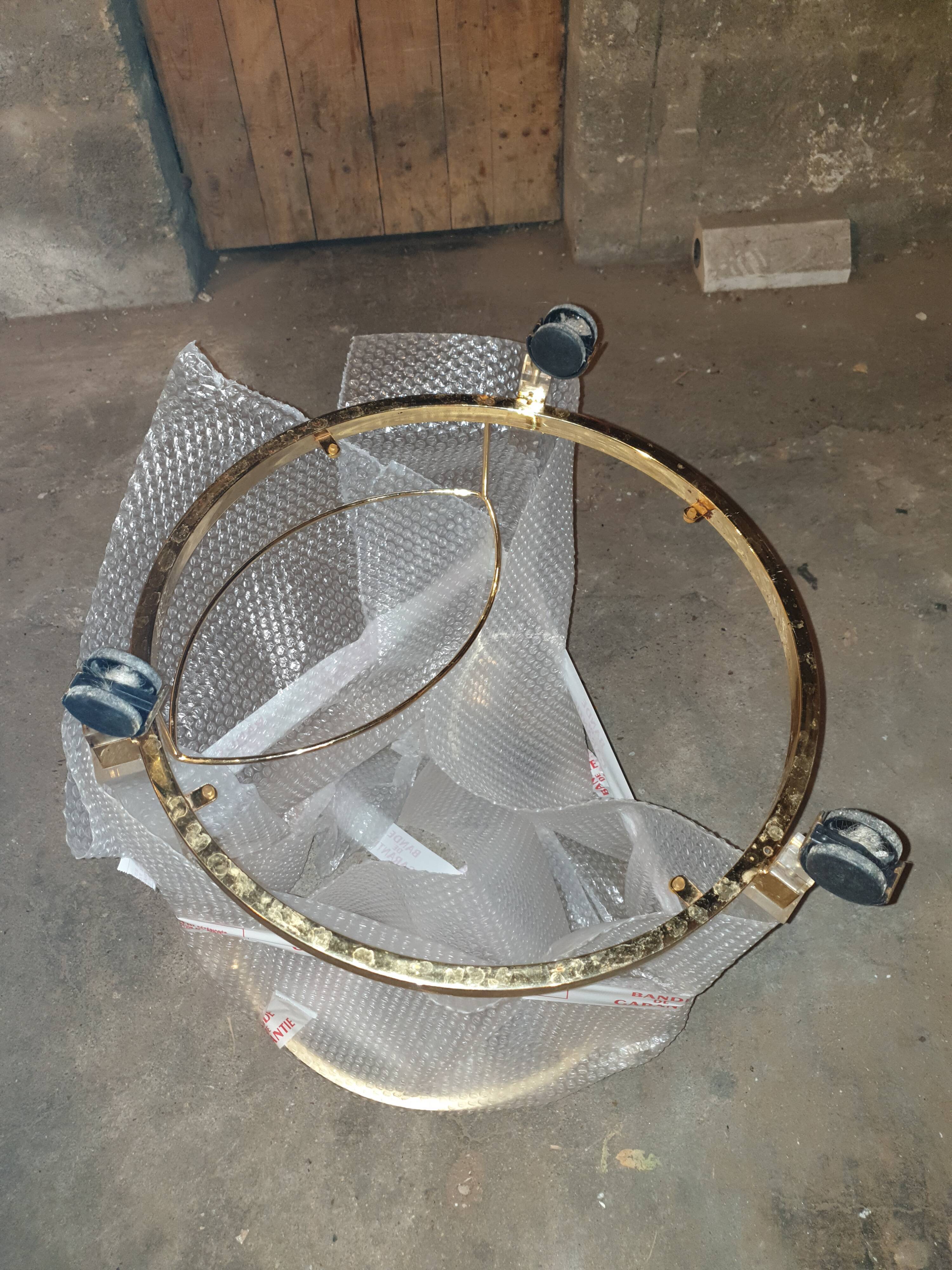 Round table in glass and brass and acrylic columns, 1980