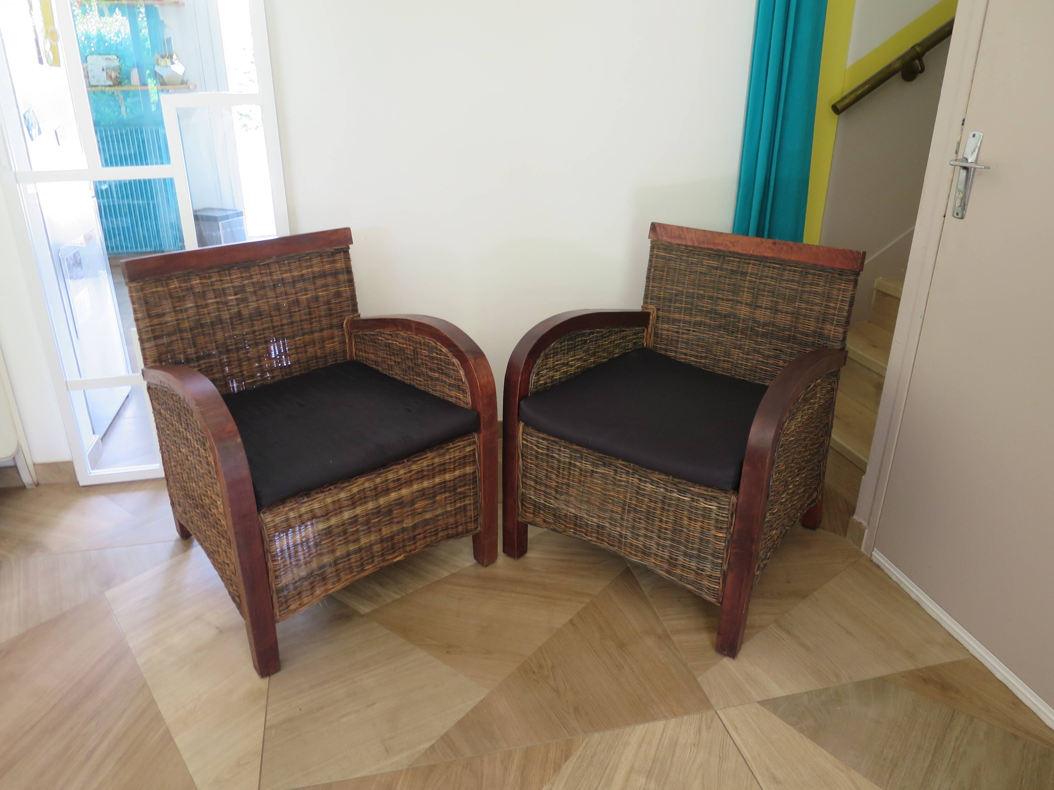 2 colonial-style armchairs in woven rattan and exotic wood