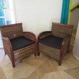 2 colonial-style armchairs in woven rattan and exotic wood