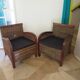 2 colonial-style armchairs in woven rattan and exotic wood