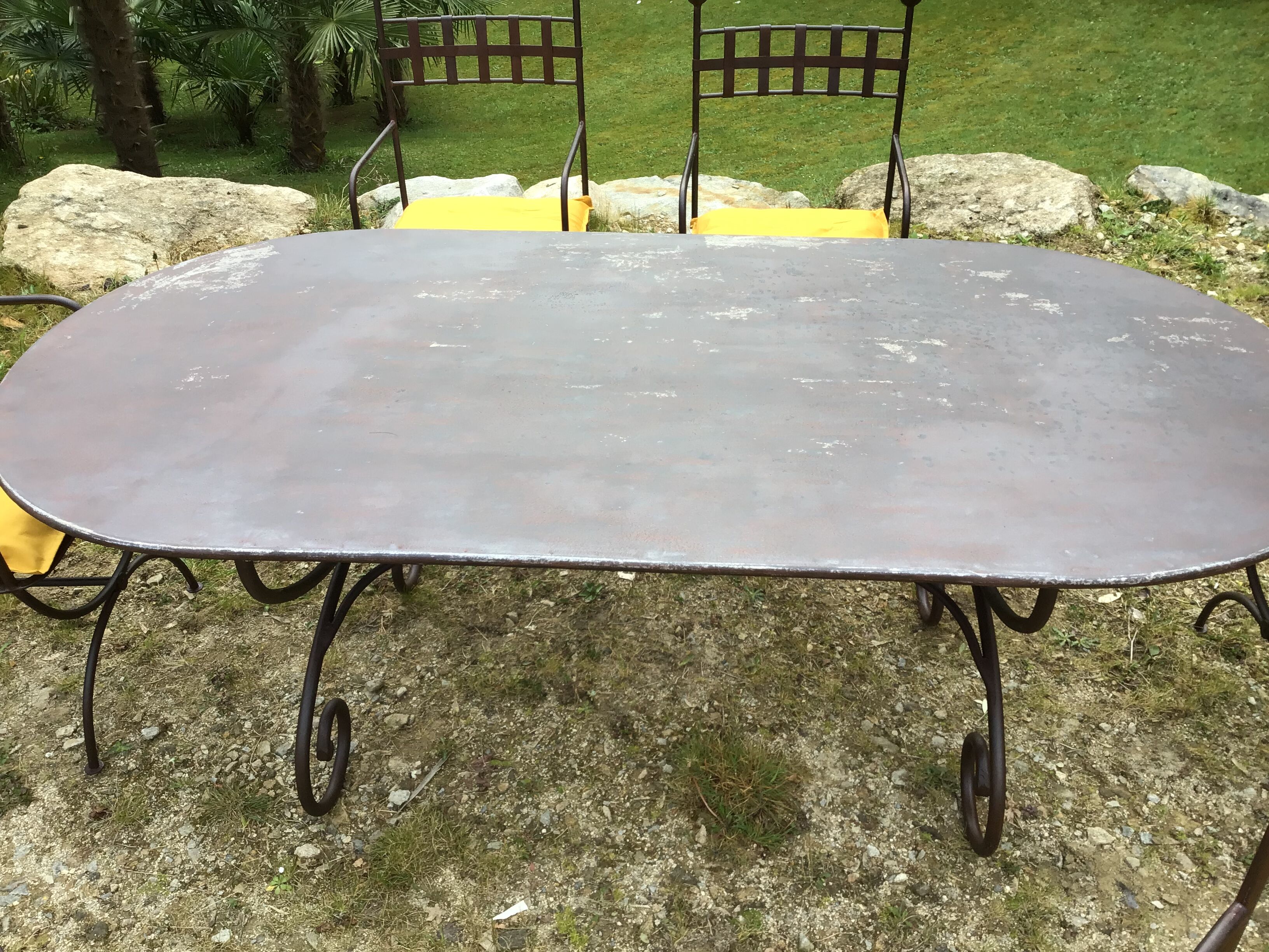 Table & 6 wrought iron chairs, 6 cushions