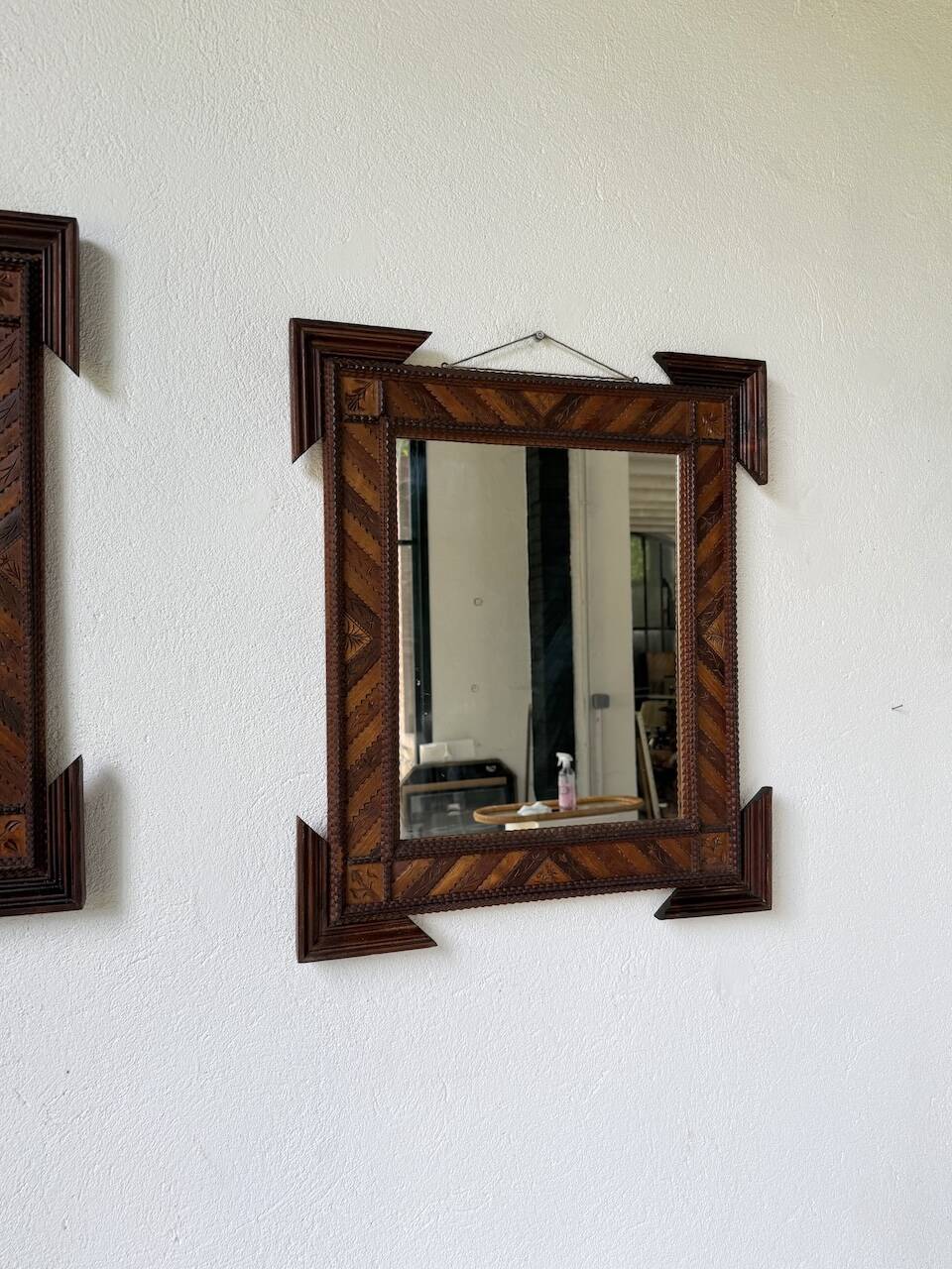 Pair of wooden mirrors in tramp art style