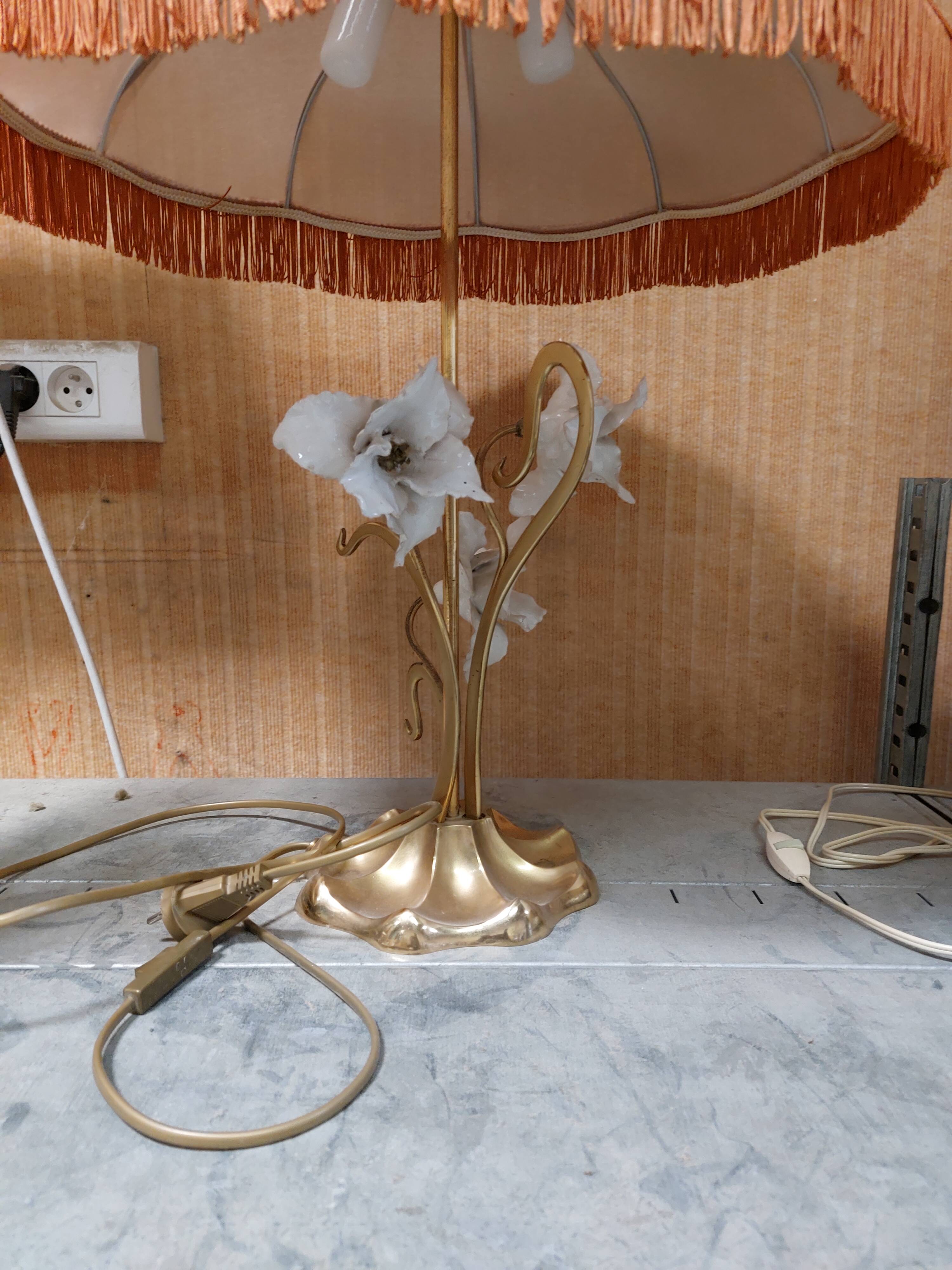 Large gilded brass lamp with white porcelain fleur-de-lis decoration