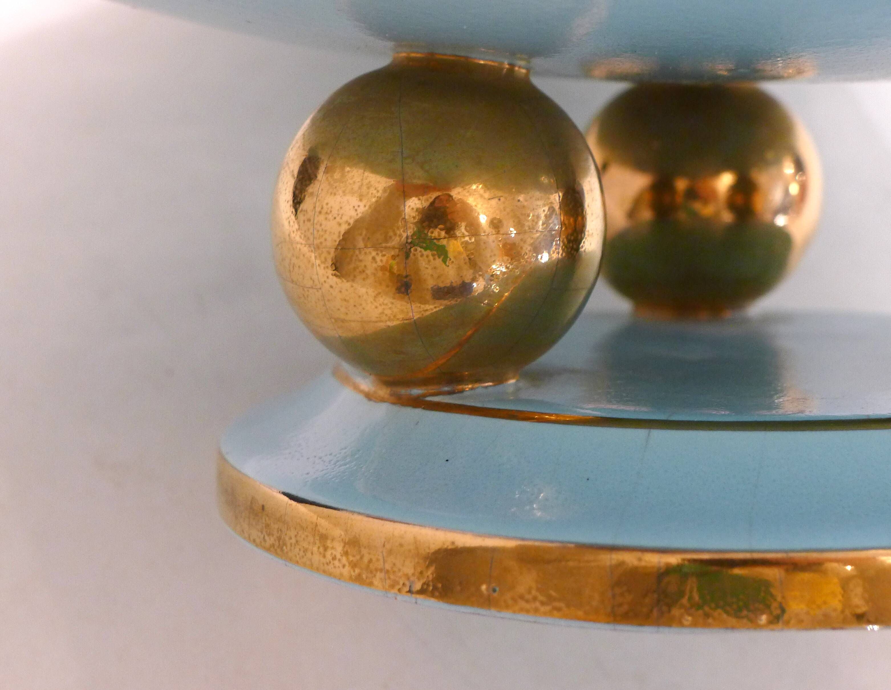 Art Deco modernist coupe, with a base of 3 spheres, in turquoise ceramic and gilding.